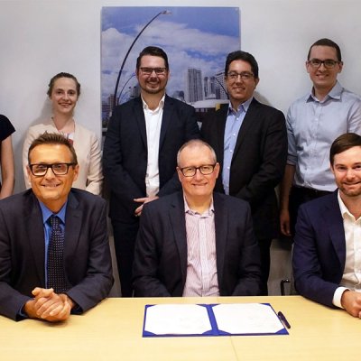 Front row: UQ School of Civil Engineering head Professor Simon Washington, UQ Director of Research Partnerships Joe McLean, VLC CEO Tim Veitch. UQ's Dr Jake Whitehead (back row, third from left)